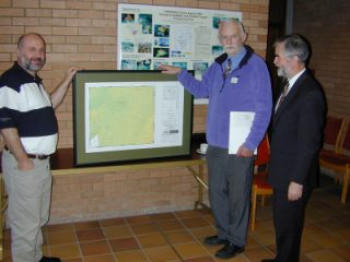 November 2001 Mick Geoghegan, Project Manager National Seabed Survey, presents Ray with one of the first maps from the Survey, one including a mound named after Ray himself!